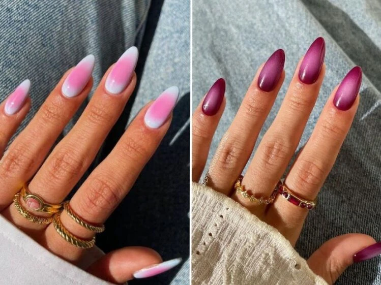 Exemplo de uma das tendências em alongamentos de unhas citadas neste post, ao lado esquerdo uma mão com unhas em formato stiletto e efeito aura com degradês suaves com as cores branco e rosa.
E ao lado direito temos uma mão com unhas em formato stiletto e efeito aura com degradês suaves com as cores branco e roxo intenso/vinho. Além de anéis para decorar.